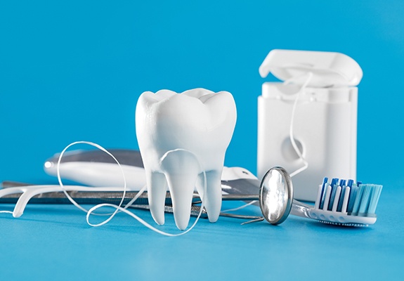 Model tooth and dental treatment tools