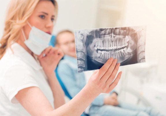 Dentist showing patient his X-ray