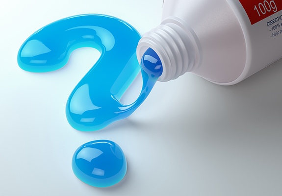 Question mark written in toothpaste representing emergency dentistry frequently asked questions
