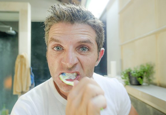 Woman holding a toothbrush