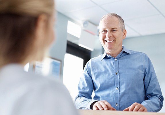 Dental patient discussing dental insurance coverage