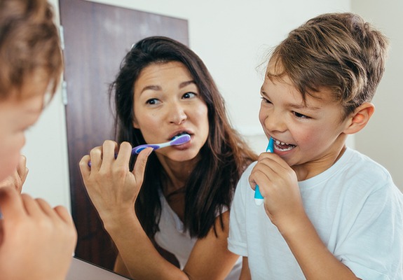 Mother and child during at home dental care routine