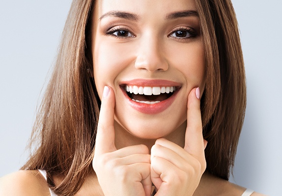 Woman showing off smile after teeth whitening