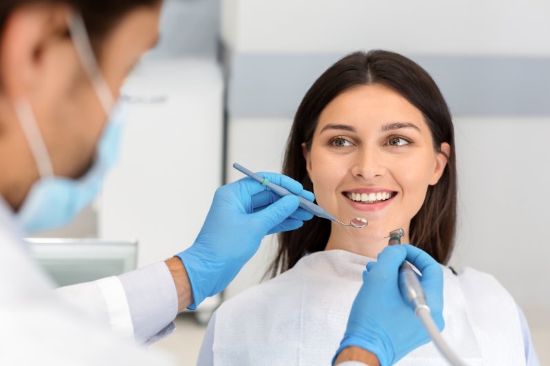 woman listening to her dentist during checkup